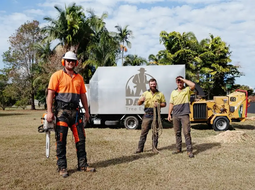 The Dan's Tree Experts crew with the truck, chipper and climbing gear